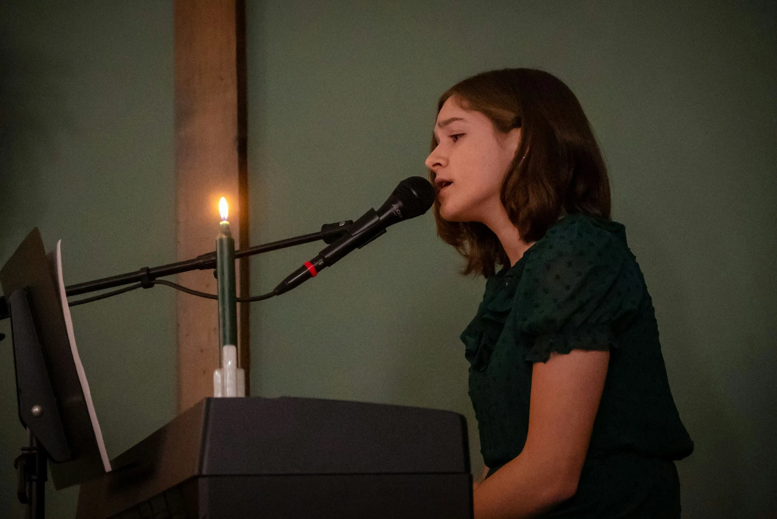 A person singing into a microphone